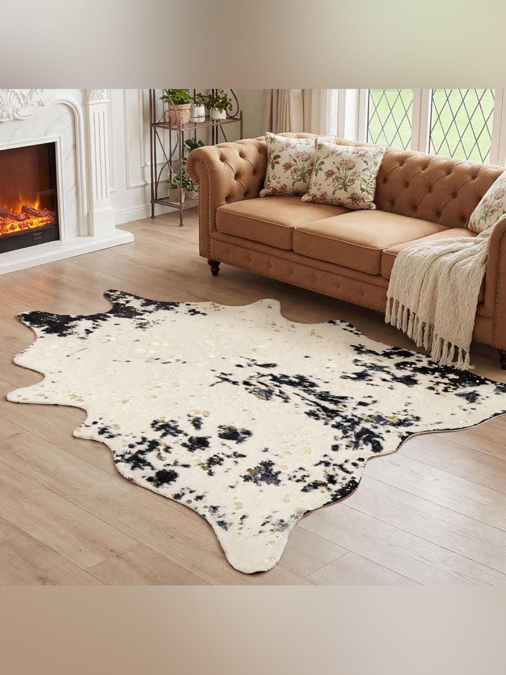Ivory Faux Cowhide Area Rug with Black and Gold Splatters